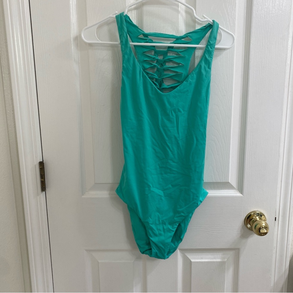 Becca by Rebecca Virture one piece bathing suit, teal lace back small cut out